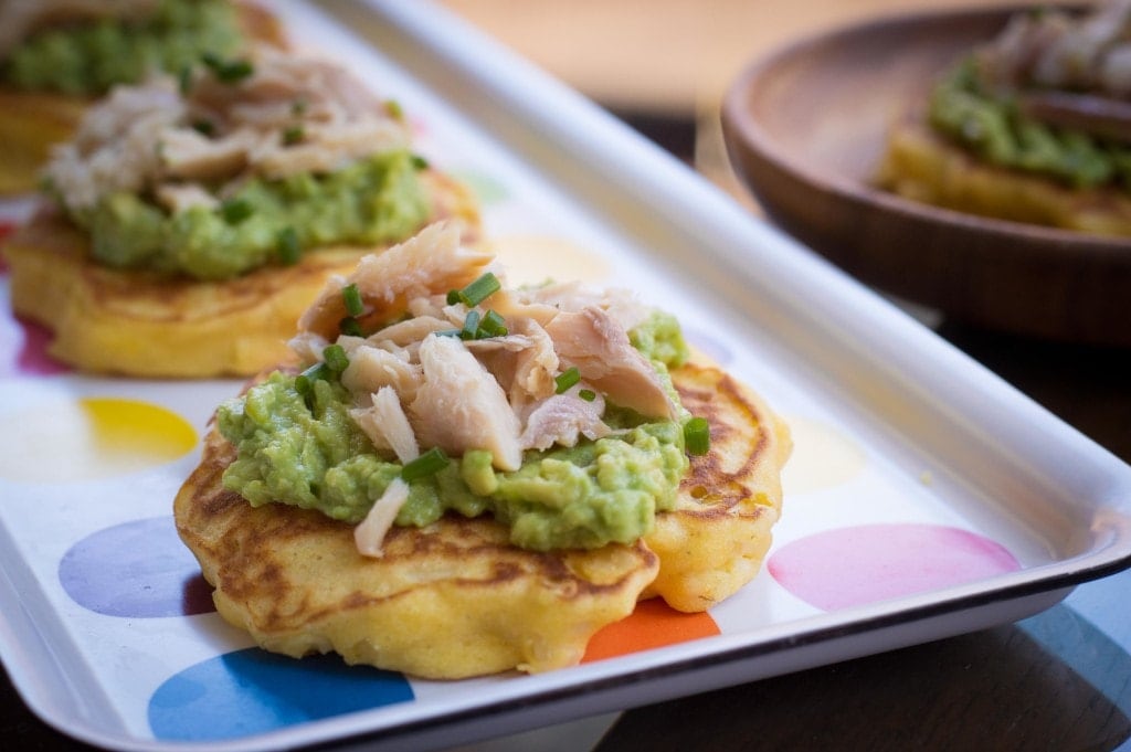 corn cakes with avocado and smoked trout