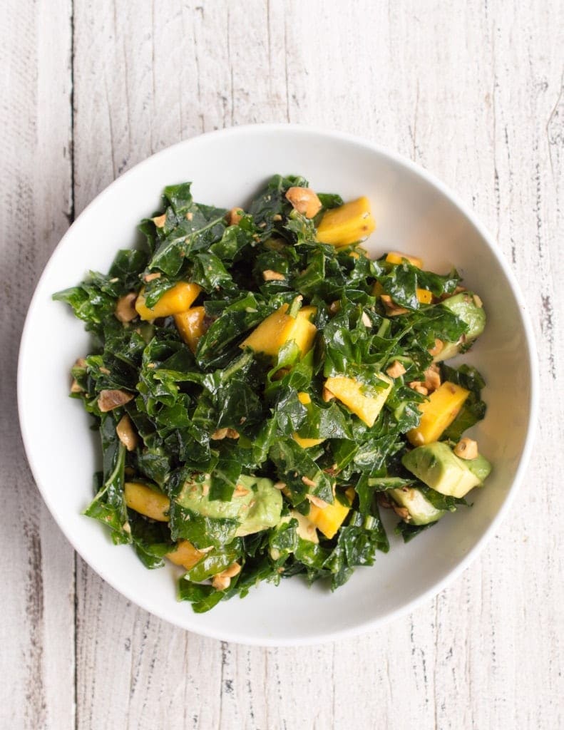 massaged-kale-salad-avocado-mango-hazelnut-overhead